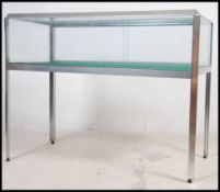A contemporary aluminium shop / museum display cabinet having glass cabinet top of rectangular