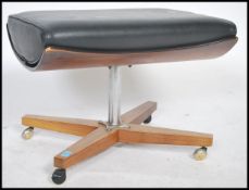 A retro 1970's ottoman footstool on the manner of Charles & Ray Eames having panel wood base with