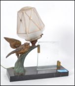 A 1930's Art Deco marble and gilt bronze ? metal table lamp with cold painted with songbird and tree