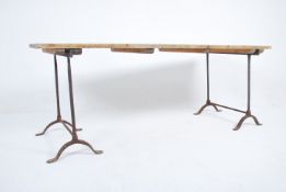 A large vintage mid century Industrial plank top r