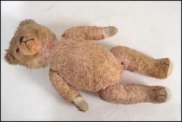 An early 20th century large straw filled growler t