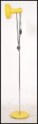 A 1980's retro Italian adjustable yellow and chrome floor standing spot light lamp with single