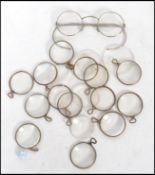 A good collection of vintage opticians eye pieces / testing optics each having a metal wire frame