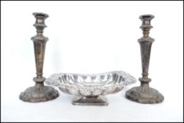 A Victorian silver plate on copper bread dish having a lobed rectangular bowl with rococo foliate