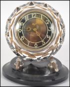 A 20th century Russian 17 jewel movement mantel clock, having faceted circular surround to Arabic