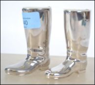 A pair of silver plated Grenadier boots - spirit measures complete with the liners. Measures 9cms