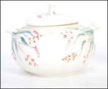 A Belleek Grass Pattern large covered sugar bowl (10cm tall), carrying the first period black mark.
