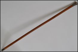 A 19th century silver white metal knopped Malacca walking / swagger stick, the silver knop decorated