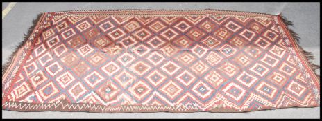 A large Afghan / Persian handwoven Sarhadi tribal rug having colourful ground made up of multiple
