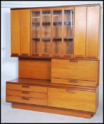 A good 1970's believed Danish teak wood upright modular display cabinet sideboard. The glass cabinet