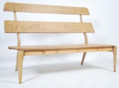 A bespoke made 20th century elm and beech wood bench / settle constructed from Parker Knoll and