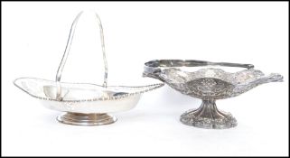 A good silver plated pierced and chased basket with arched cast handle being raised on a shaped