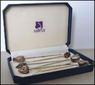 A 20th century cased set of silver white metal cocktail / fondue forks with fruit finials to top