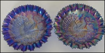 A pair of Northwood American electric blue carnival glass bowls with stippled ray edges each moulded