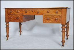 A good Victorian mahogany writing table desk in the manner of Gillows. Raised on tapering reeded