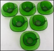 A retro / 1970's 6 piece French green glass part tea set comprising cups and saucers marked for