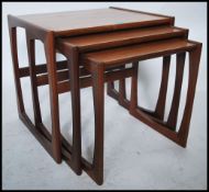 A G-Plan retro teak wood 1970's graduating nest of tables in the Quadrille pattern. The tables