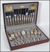 A mahogany cased silver plated complete 44 piece canteen of cutlery by Viners entitled Harley