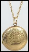 A 9ct gold necklace with 9ct gold front and back locket. The chain 60cms in length 2.9g / total