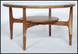 A retro 1970's 20th century G Plan - ' Astro ' teak coffee table with circular glass inset top