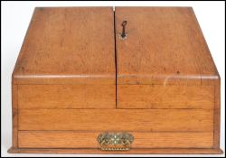 A Victorian twin door stationary desk tidy having a fitted interior with locking drawer to
