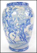 A believed 19th century Chinese vase of baluster form with blue and white decoration of flowers