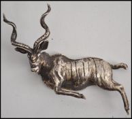 An unusual silver mounted stag figural piece having unusual flat back. The item believed mounted