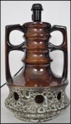 A retro 20th century twin handled West German table lamp of tall form having a cream and brown
