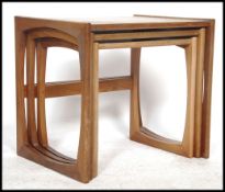 A G-Plan retro teak wood 1970's graduating nest of tables in the Quadrille pattern. The tables