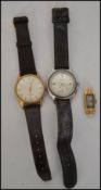 A 14ct gold ladies dress watch face by Waltham together with a gents vintage Roamer with black