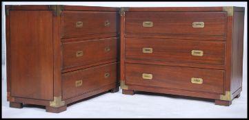 A pair of 20th century mahogany and brass bound campaign chests. Each with inset plinth base