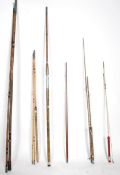 A large collection of vintage fishing rods to incl