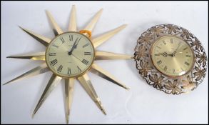 A retro 20th century Metamec sunburst / starburst wall clock in chrome along with another Metamec