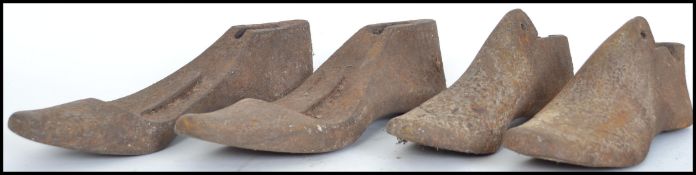 A collection of cast iron believed 19th century cobblers shoe moulds ( see illustrations )