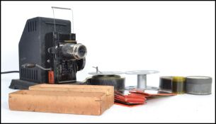 A vintage early 20th century Bing British Film projector of tinplate construction and in the