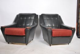 A stunning pair of retro 1970's two tone black and red vinyl upholstered  armchairs having flashwork