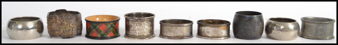 A silver Chinese napkin ring ( tested )together with a pair of silver hallmarked English napkin