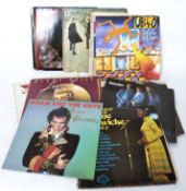 A collection of long play vinyl records to include several artists such as UB40, Manfred Mann,