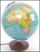 A retro 20th century desk top globe on swivel mount being marked for Columbus Duplux Erdglobus.