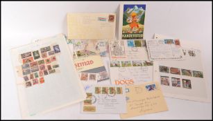 A collection of vintage stamps to include British, South African and others. Most mounted on paper