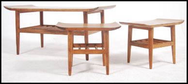 A collection / trio of 3 retro teak wood / formica coffee tables to include surfboard style tops and