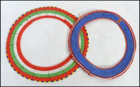 A pair of large vintage African Tribal Maasai bead work wedding necklaces having varying strands