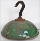 A mid century industrial green and white enamel painted pendant light having inset 6 bulb fitment to