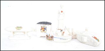 A good group of rare mostly WW1 era goss / crested wares to include a Longton coal wagon, a The