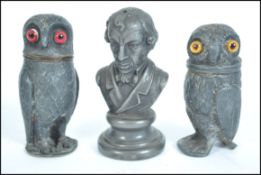A group of three Victorian 19th century condiments one in the form of Benjamin Disraeli and two in