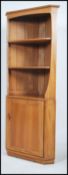 A contemporary  Ercol freestanding Elm corner display unit with two open shelves above cupboard