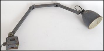 A vintage 20th century Industrial Memlite anglepoise desk - wall mounted work lamp in original