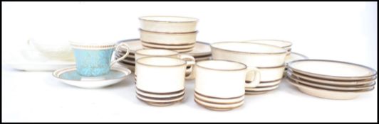 A 20th century Denby part dinner service in an oatmeal finish consisting of various plates,