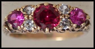 A hallmarked 9ct gold ruby and white stone ring ,s