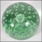 A large believed 19th / early 20th century Nailsea green glass control bubble dump / paperweight